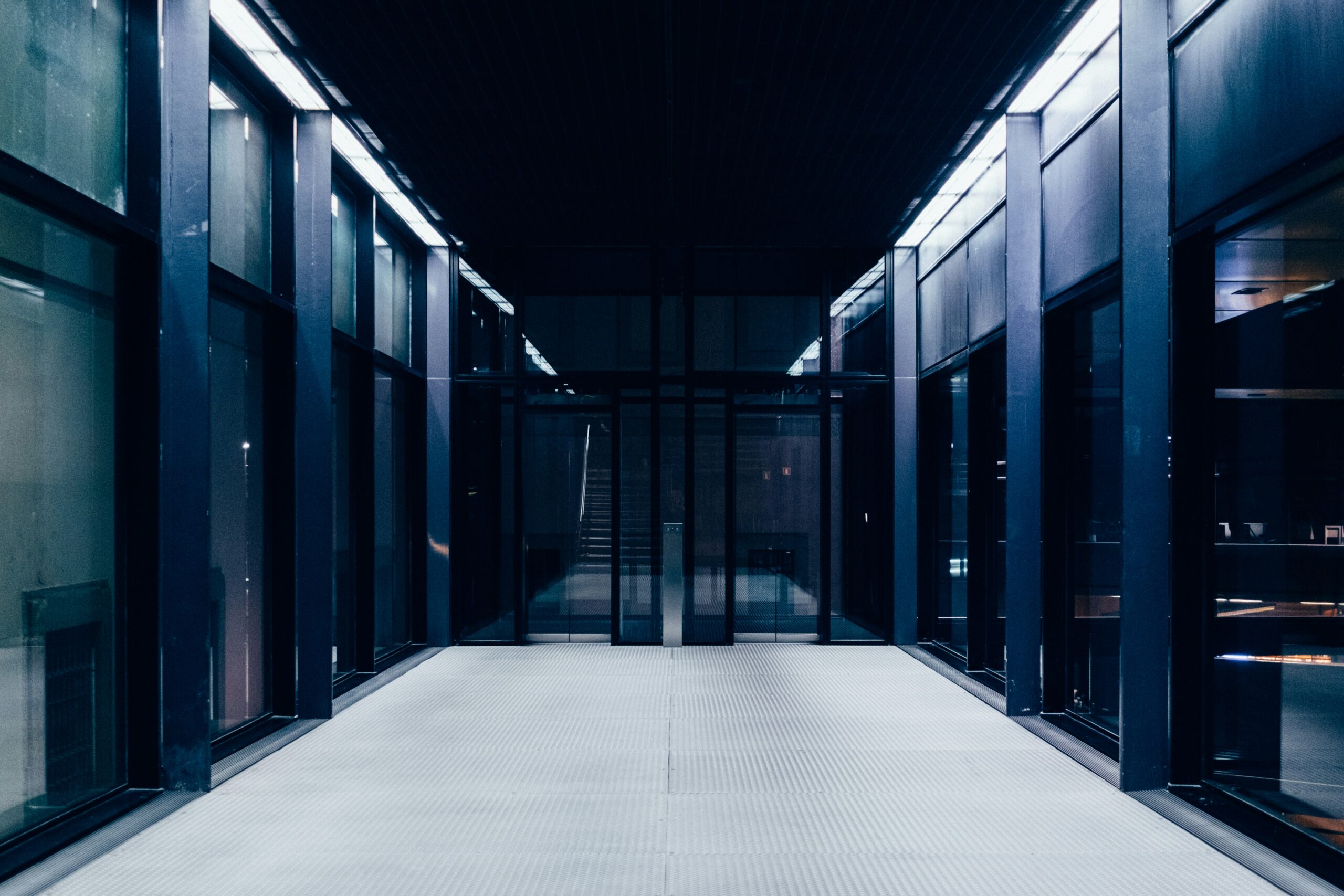 Image of an empty server room. Photo by Paul Hanaoka on Unsplash